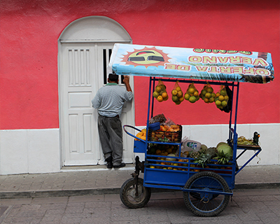 guatemala flores fruit cart pink house